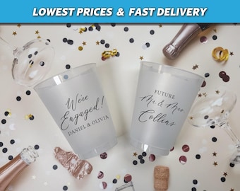 May include: Two clear plastic cups with black text. One cup says "We're Engaged! Daniel & Olivia". The other cup says "Future Mr. & Mrs. Collins".