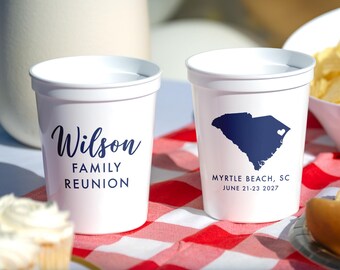 May include: Two white plastic stadium cups featuring dark blue text and graphics. One cup displays the text Wilson FAMILY REUNION. The other cup shows a dark blue map of South Carolina with a heart icon and the text MYRTLE BEACH, SC JUNE 21-23 2027.