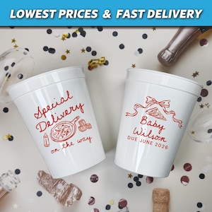 May include: Two white plastic cups with red text and graphics. One cup says "Special Delivery on the way" with a pizza graphic. The other says "Baby Wilson DUE JUNE 2026" with a bow and pizza graphic. Confetti and champagne bottles are in the background.