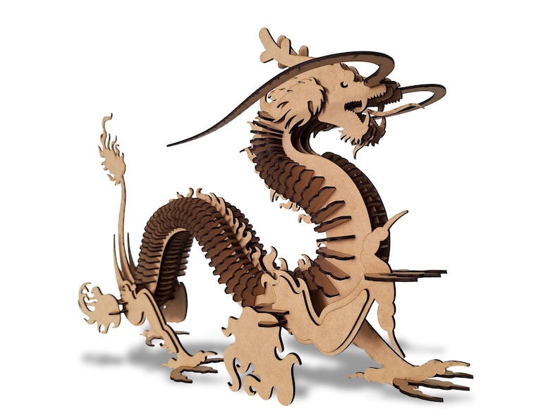 May include: A wooden dragon sculpture with intricate details. The dragon is curled up in a defensive position with its head raised and its wings spread out. The sculpture is made of light brown wood and has a natural finish.