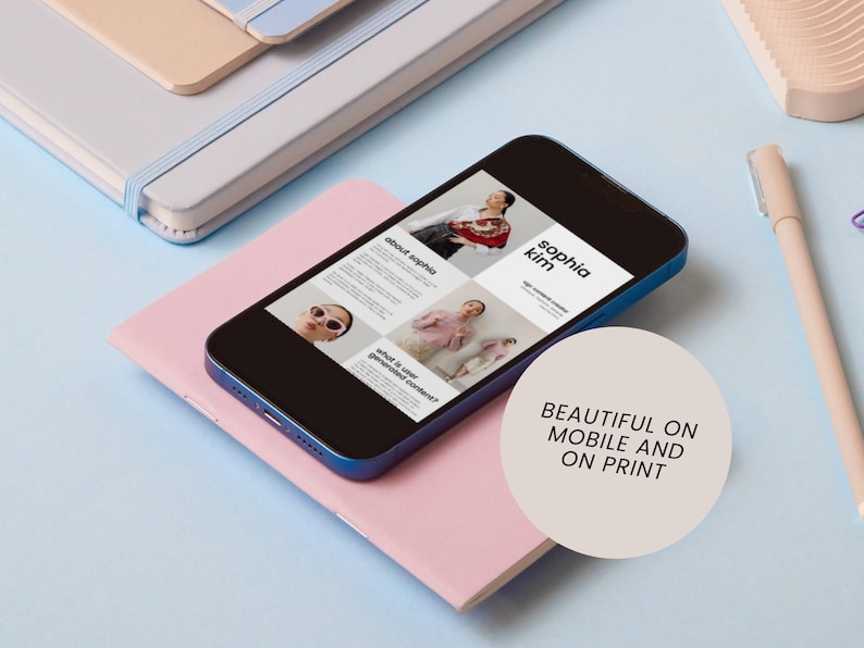 May include: A blue smartphone displaying a website with a grid of images and text. The text includes "Sophia Kim" and "about sophia". The website is designed to be visually appealing on both mobile and print.