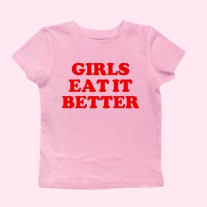 Girls Eat It Better Funny Y2K Baby Tee,  LGBTQ Pride Top, Lesbian Bisexual Retro Pride T-Shirt, Funny WLW Pink Tshirt