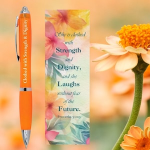 May include: Orange pen with the text "Clothed with Strength & Dignity" printed on it.  A bookmark with a floral design and the text "She is clothed with Strength and Dignity, and she Laughs without fear of the Future. Proverbs 31:25"