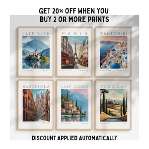 May include: Six framed travel art prints featuring iconic locations: Lake Bled, Paris, Santorini, Barcelona, Lake Como, and Tuscany. Each print showcases a scenic view with location names. Text at the top reads "GET 20% OFF WHEN YOU BUY 2 OR MORE PRINTS".