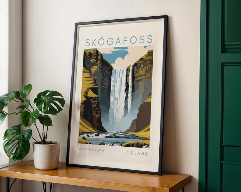 May include: Framed art print of Sk&oacute;gafoss waterfall in Iceland. The artwork features a stylized illustration of the waterfall cascading down a cliff face, with text that reads "SK&Oacute;GAFOSS" and "ICELAND". The print is in a black frame.