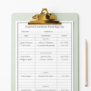 May include: A clipboard with a gold-coloured clip holding a printed "Funeral Luncheon Food Sign Up" form. The form includes sections for names, dishes, and contact information. A pencil rests on the right side.