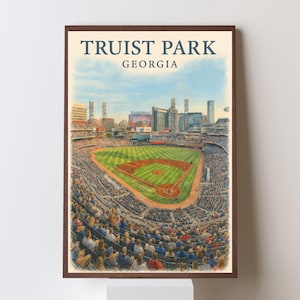 May include: A framed print of Truist Park in Georgia. The artwork depicts a baseball stadium filled with spectators, a green field, and the city skyline in the background. The text "TRUIST PARK GEORGIA" is at the top.