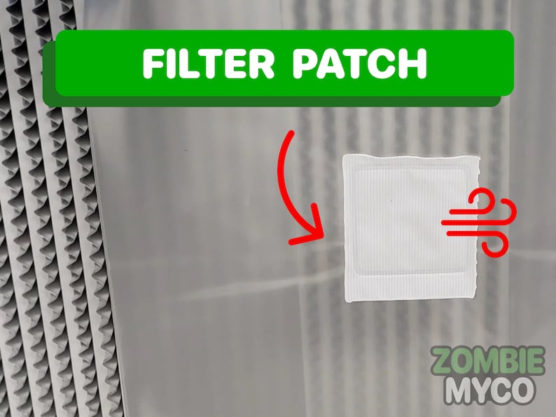 May include: A white filter patch with a red wind symbol, labeled "FILTER PATCH" in green text. The patch is attached to a clear plastic surface.