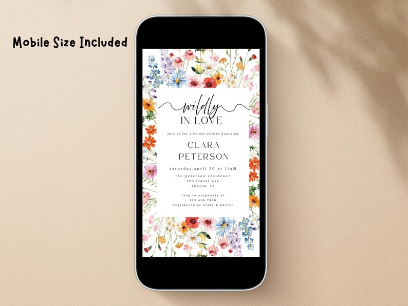 May include: A digital invitation displayed on a smartphone screen featuring a watercolor floral border with red, orange, blue, and pink wildflowers. The text reads "wildly IN LOVE", "join us for a bridal shower honoring CLARA PETERSON", and event details.