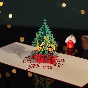 Élégante carte de Noël pop-up 3D avec arbre festif et cadeaux emballés