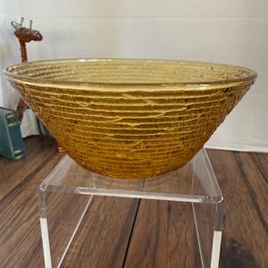 May include: A set of three ceramic mugs with a speckled, matte finish. The mugs are in shades of cream, light gray, and dark gray. Each mug has a simple, minimalist design, perfect for coffee or tea.