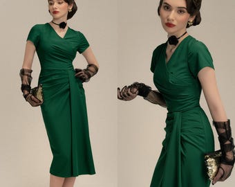 May include: A woman in a green, vintage-style dress with a V-neck and short sleeves. She wears black sheer gloves and a black choker with a flower. She holds a gold clutch. The text "YESTERDAY'S GLAMOUR" is at the bottom.
