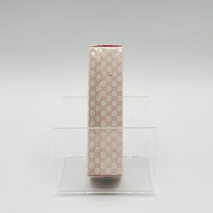 Side view of Gucci Envy Me 30ml bottle. Slim and elegant profile with signature branding.