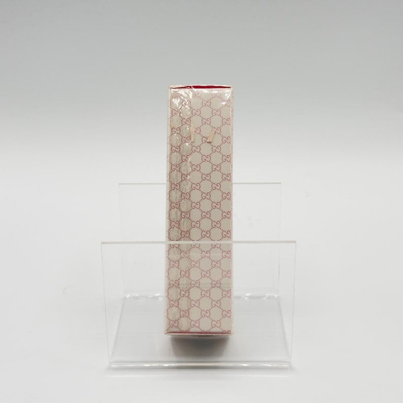 Side view of Gucci Envy Me 30ml bottle. Slim and elegant profile with signature branding.
