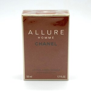 May include: A brown box of Chanel Allure Homme after shave lotion. The box has gold trim and the Chanel logo on top. The front of the box has the words "ALLURE HOMME CHANEL" in white and brown lettering. It contains 1.7 fl. oz. (50 ml).