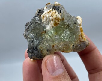 137.50gram natural green Fluorite crystal specimen with blue tourmaline and feldspar from Skardu Pakistan.