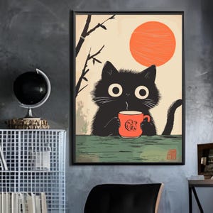 May include: A framed art print featuring a black cat holding a red mug with a Japanese-inspired design. The cat has large, wide eyes and is set against a backdrop of a rising orange sun and bamboo. The artwork has a vintage, minimalist style.