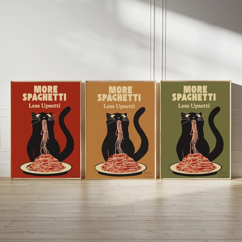 May include: Three rectangular wall art prints featuring a black cat eating a plate of spaghetti. Each print displays the text MORE SPAGHETTI Less Upsetti in a different background color: red, tan, and olive green. The cat has a long tail.