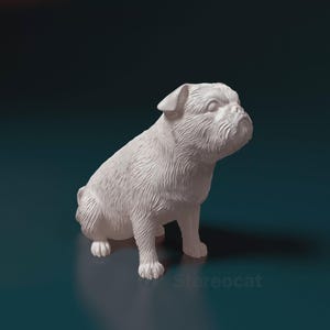 May include: A white bulldog figurine in a seated position. The sculpture has detailed fur texture and a slightly furrowed brow, giving it a lifelike appearance. The figurine is set against a dark teal background.