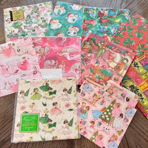 May include: A collection of colorful wrapping paper sheets with various festive designs, including princesses, Santa Claus, and Christmas trees. The sheets are arranged on a round wooden table, showcasing a variety of patterns and colors.