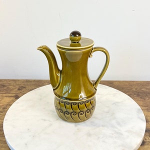 May include: A rustic wooden sign with the text "Welcome to our home" in a handwritten style. The sign features a distressed finish and a simple, inviting design, perfect for a front porch or entryway.