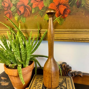 May include: A handmade wooden sign with the text "Welcome to our home" in a handwritten style. The sign is painted white with a distressed finish and a dark brown border. It is designed for indoor or outdoor use.