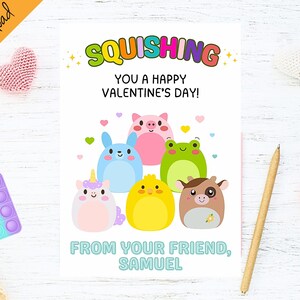 May include: A Valentine's Day card with a colorful squishing theme. The card features a group of cartoon animals, including a unicorn, a pig, a frog, a chick, and a cow. The card reads "Squishing You a Happy Valentine's Day!" and "From Your Friend, Samuel."