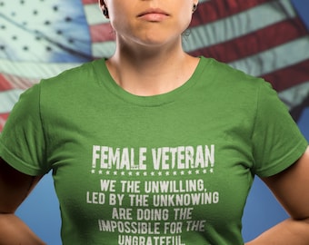 May include: A green t-shirt with a white graphic print that reads "FEMALE VETERAN" and a quote about the challenges and rewards of military service.