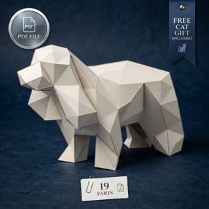 May include: A low-poly paper sculpture of a dog in an off-white color. The sculpture is composed of geometric facets. A small white rectangular tag with a paperclip displays the text 19 PARTS. A blue ribbon banner reads FREE CAT GIFT INCLUDED.