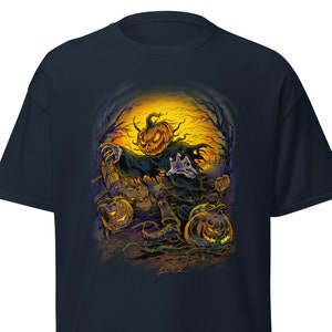 May include: A dark blue t-shirt with a graphic of a scary pumpkin-headed figure with glowing eyes and a menacing grin. The figure is surrounded by other pumpkins in a dark forest setting.