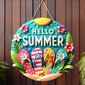 May include: A round, turquoise wooden sign with the words "HELLO SUMMER" in white. The sign features a yellow sun, pink and white flowers, green leaves, and four pairs of colorful flip-flops. A white string is attached for hanging.