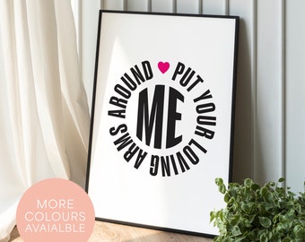 May include: Black and white print with a pink heart in a circle that says "Put your loving arms around me".