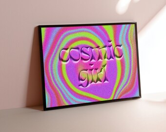 May include: A framed print with a psychedelic swirl pattern in pink, green, and blue colors. The text "cosmic girl" is in a 3D style font.