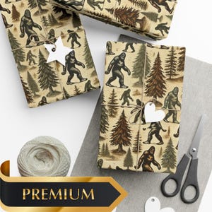 May include: Brown wrapping paper with a repeating pattern of Bigfoot and pine trees. The paper is tied with twine and has a white star-shaped tag.