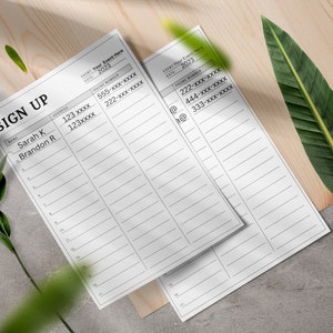 May include: A sign up sheet with the title "SIGN UP" and columns for name, address, and phone number. The sheet is on a wooden surface with green leaves.