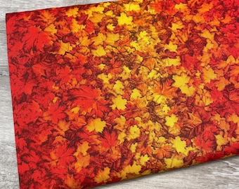 Peut inclure: Un tissu plié avec un motif de feuilles d'automne vibrant. Le motif présente une disposition dense de feuilles d'érable dans des tons de rouge, orange et jaune, créant une esthétique chaleureuse et saisonnière. Idéal pour les créations et la décoration sur le thème de l'automne.