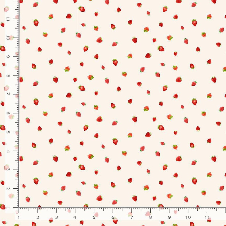 May include: A fabric with a repeating pattern of red strawberries with green leaves scattered across a cream-colored background. The strawberries vary in size and are evenly spaced, creating a playful and cheerful design.