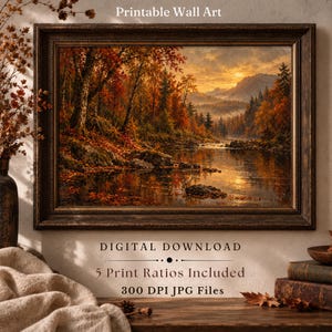 Puede incluir: Un cuadro de paisaje enmarcado que muestra un bosque otoñal con follaje naranja y rojo, un río tranquilo y montañas lejanas bajo un cielo de atardecer dorado. El texto dice: Printable Wall Art, DIGITAL DOWNLOAD, 5 Print Ratios Included, 300 DPI JPG Files.