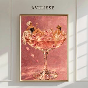 May include: A framed wall art print titled AVELISSE featuring an oil painting of two figures in a large pink cocktail glass filled with liquid and floating petals. One figure wears a white towel wrap, the other a white swimsuit, both holding glasses.
