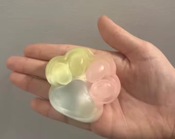 Giocattolo antistress a forma di zampa arcobaleno, morbido e spugnoso.