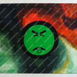 May include: A green and black painted canvas with a green circle containing a cartoon face with a tongue sticking out and angry eyebrows. The background is a mix of red, green, and black.