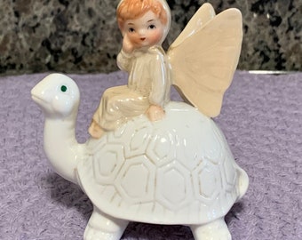 Enesco 1980 Ceramic Blue Eyed Turtle With Winged Child