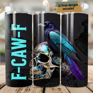 May include: Black tumbler with a teal and purple raven perched on a teal and gold skull. The tumbler has the text "F-CAW-F" in teal. The design includes 12 free designs. The tumbler has a straw.