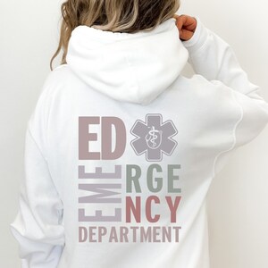 May include: White hooded sweatshirt with the text "ED EMERGENCY DEPARTMENT" in a vertical column with a medical symbol in the center. The text is in different colors, including pink, gray, green, and red.