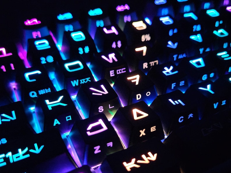May include: A close-up of a black mechanical keyboard with colorful backlighting. The keys are labeled with letters, numbers, and symbols. The keyboard has a modern design and is perfect for gaming or typing.