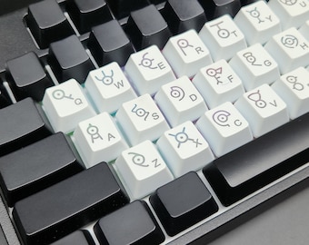 Juego de teclas retroiluminadas en blanco roto de Pokémon Unown (de la A a la Z / 26 teclas) / Juego de teclas de anime / Juego de teclas para teclado mecánico / Juego de teclas para juegos