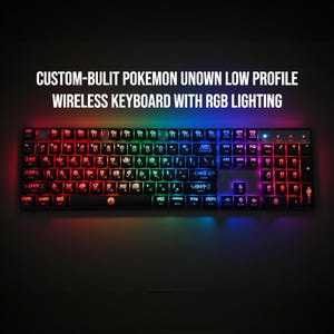 May include: A black wireless keyboard with RGB lighting. The keyboard features custom keycaps with Pokemon Unown symbols. The keys are illuminated with a rainbow of colors, including red, green, and blue. The text "CUSTOM-BULIT POKEMON UNOWN LOW PROFILE WIRELESS KEYBOARD WITH RGB LIGHTING" is displayed.