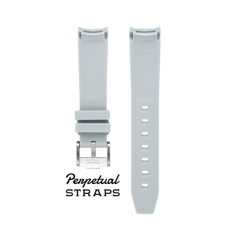 May include: Two light gray watch straps with a stainless steel buckle. The straps are made of a flexible material and feature the text "Perpetual STRAPS" in black. One strap has adjustment holes.