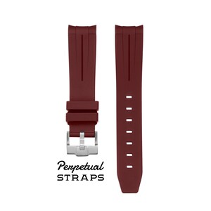 May include: Two burgundy watch straps with a silver buckle. The straps are made of a flexible material and feature a series of holes for adjustment. The text "Perpetual STRAPS" is printed below the straps.