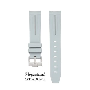 May include: Light gray watch strap with a stainless steel buckle. The strap has a vertical black stripe and the text "Perpetual STRAPS" in black cursive font.